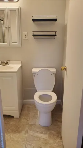 a bathroom with a toilet and a sink