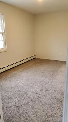 a street sign that is in front of flowers