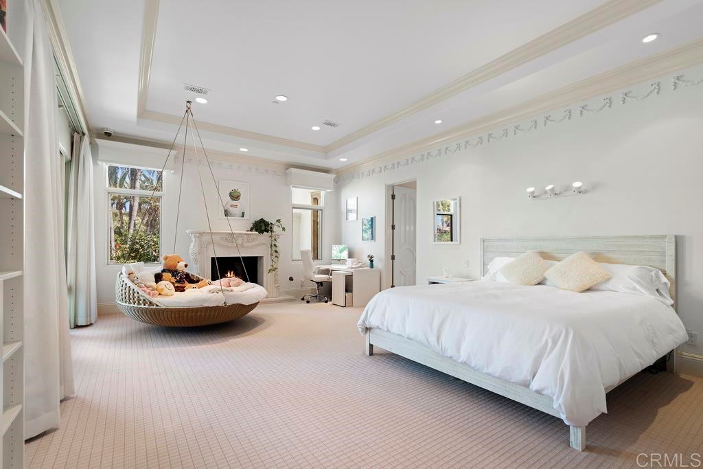 6424 La Valle Plateada Rancho Santa Fe, CA 92067 - Photo 13 of 21 a bedroom with a bed and a couch