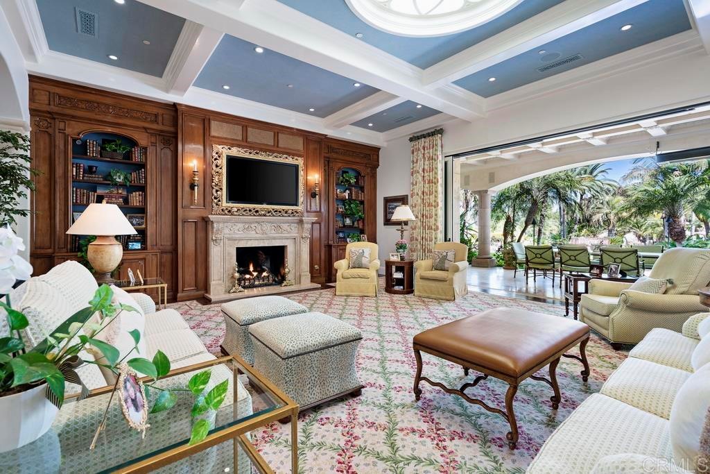 6424 La Valle Plateada Rancho Santa Fe, CA 92067 - Photo 7 of 21 a living room with furniture fireplace and a flat screen tv