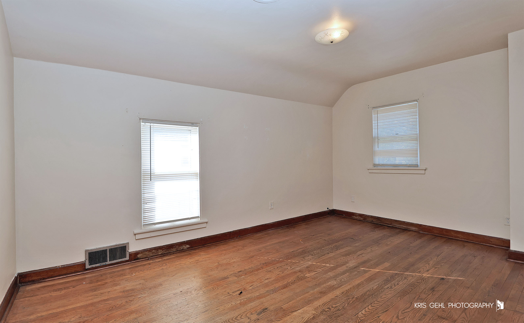428 North Poplar Street Waukegan, IL 60085 - Photo 12 of 22 an empty room with wooden floor and windows
