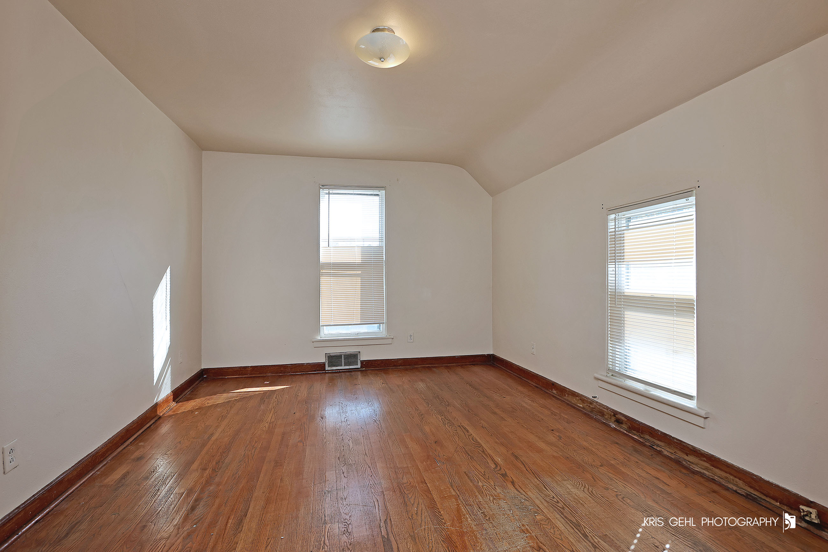 428 North Poplar Street Waukegan, IL 60085 - Photo 14 of 22 an empty room with wooden floor and windows