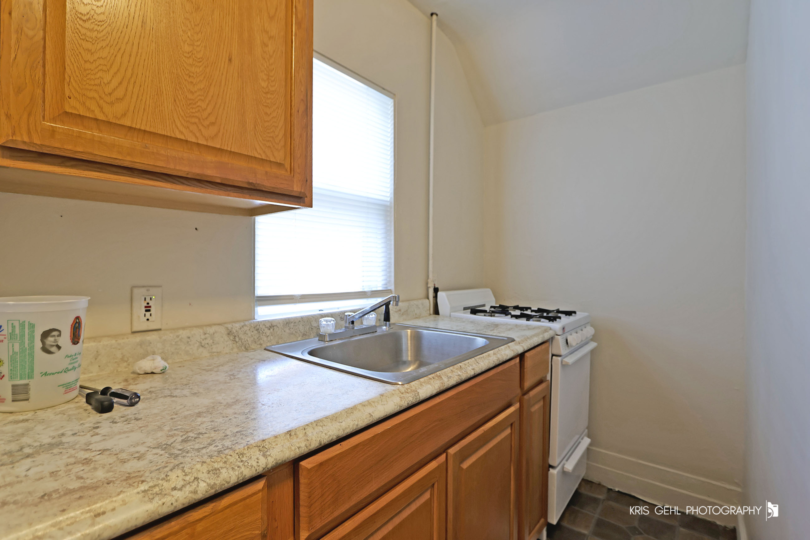 428 North Poplar Street Waukegan, IL 60085 - Photo 16 of 22 a kitchen with a sink and cabinets