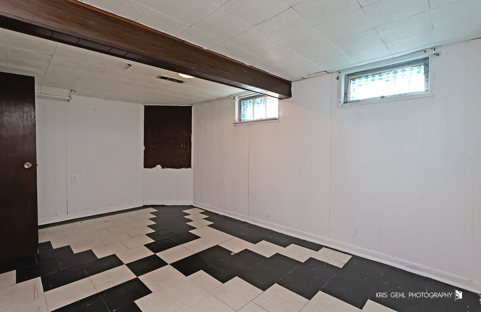 428 North Poplar Street Waukegan, IL 60085 - Photo 20 of 22 a view of a room with wooden floor and cabinets