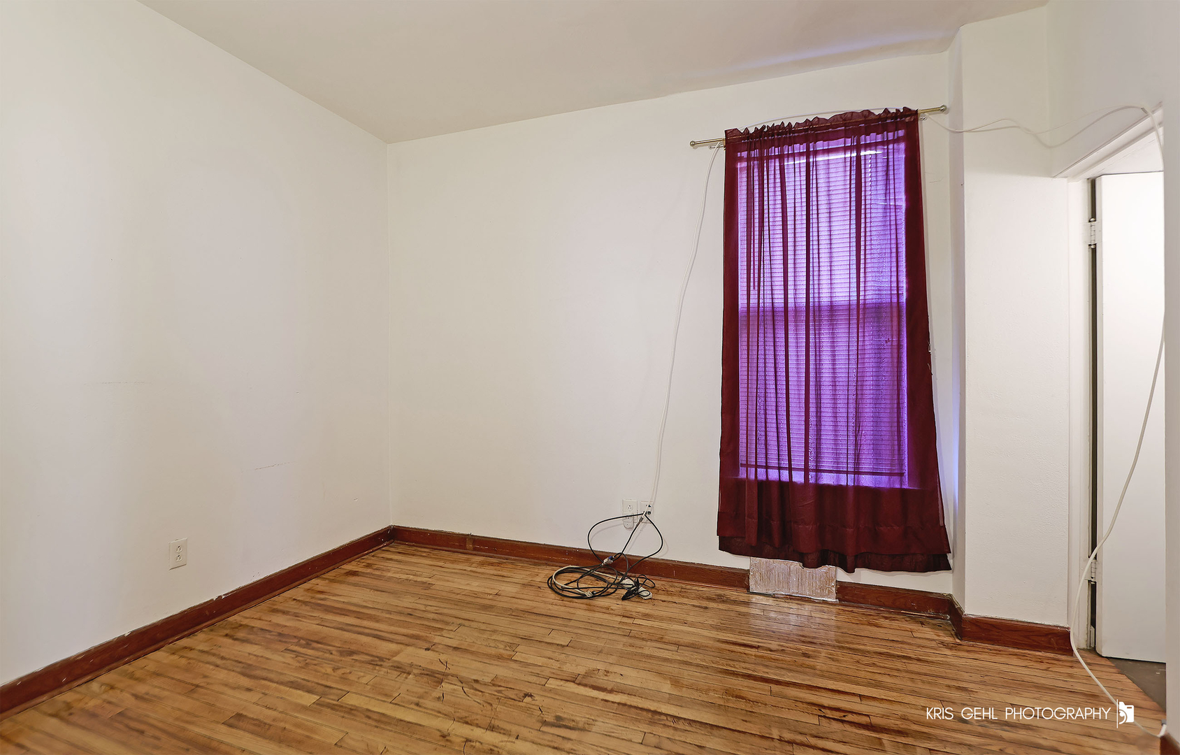 428 North Poplar Street Waukegan, IL 60085 - Photo 5 of 22 a view of a room with wooden floor and windows