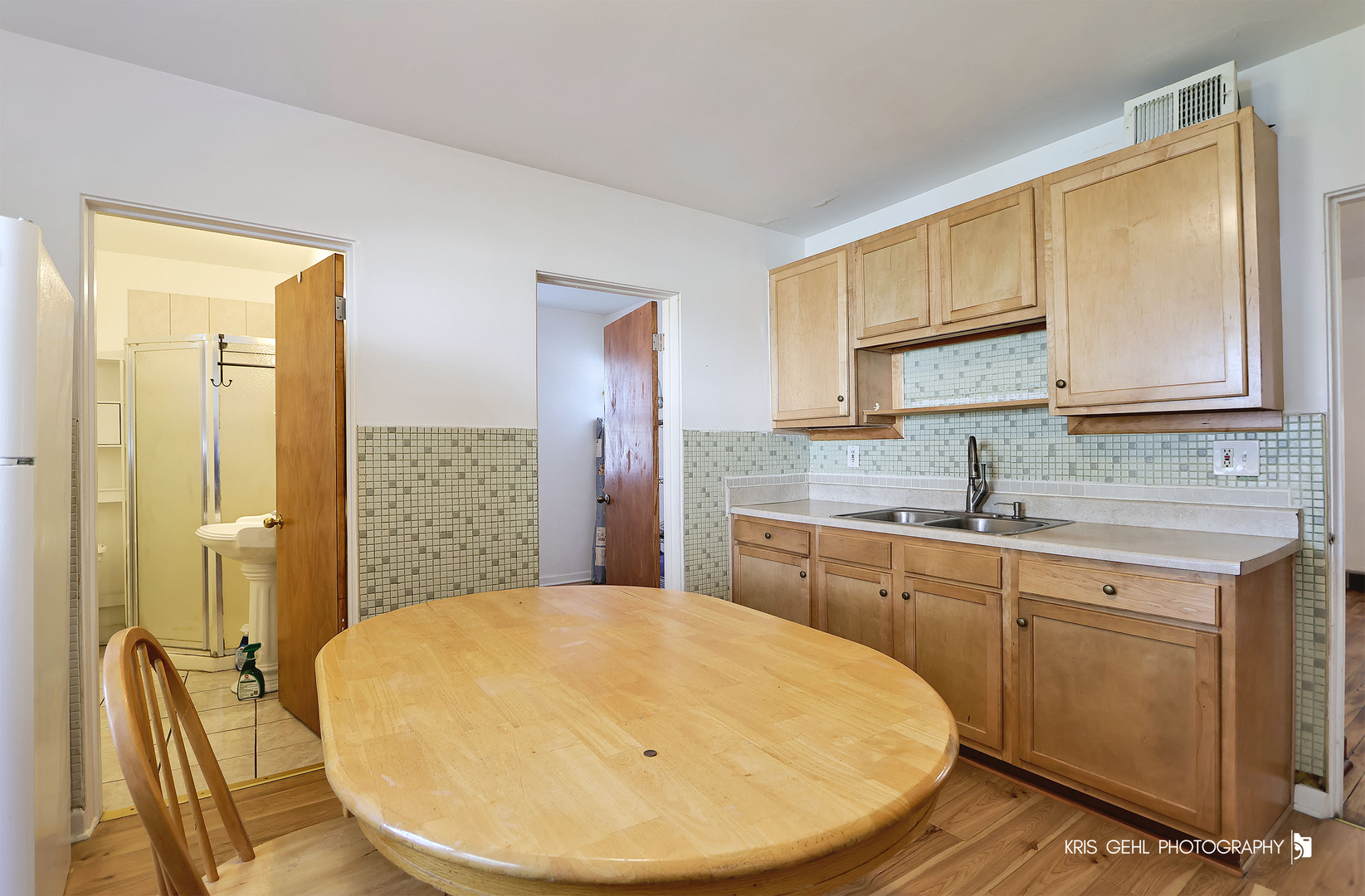 428 North Poplar Street Waukegan, IL 60085 - Photo 8 of 22 a kitchen with a sink a stove and cabinets