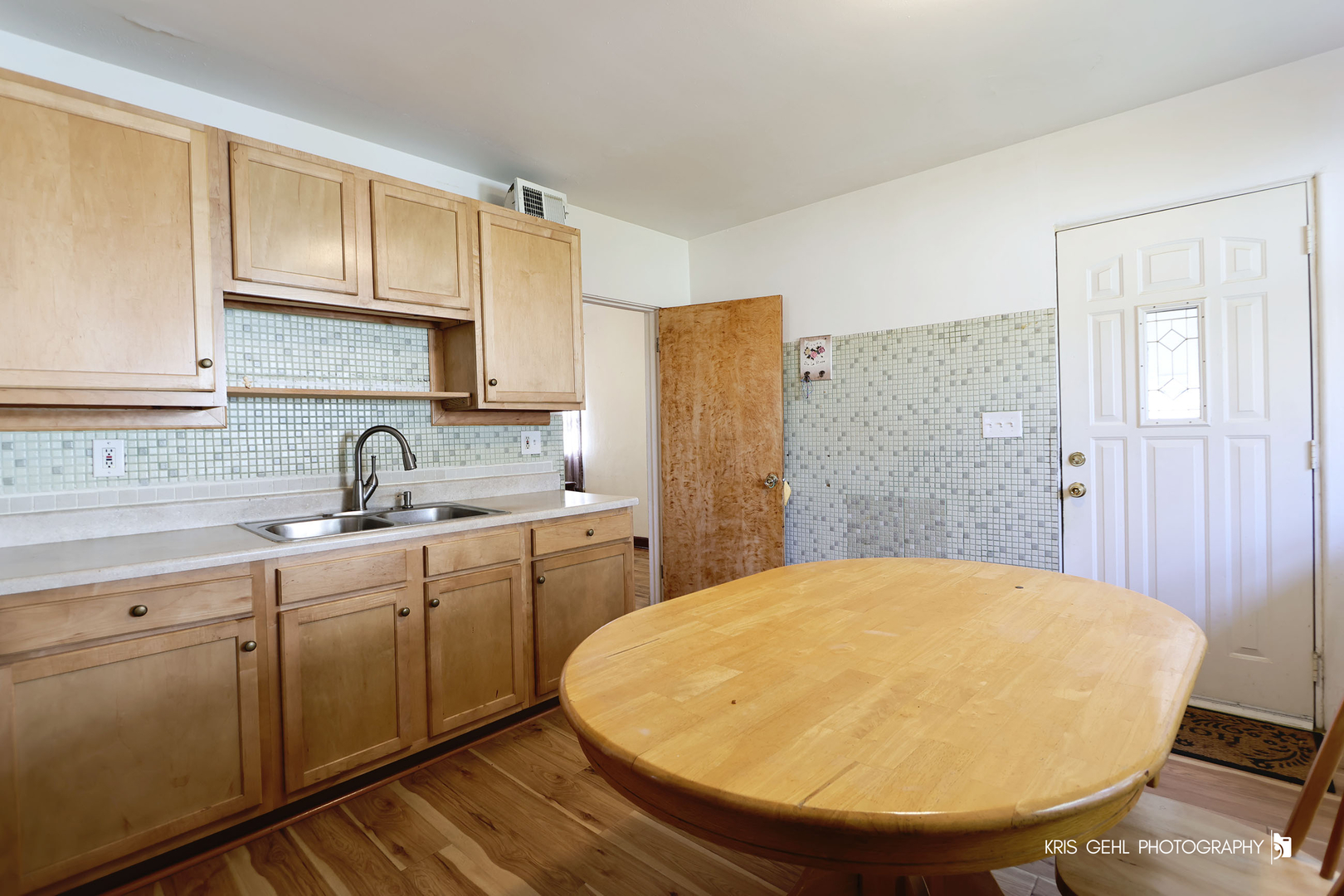 428 North Poplar Street Waukegan, IL 60085 - Photo 10 of 22 a bathroom with a sink mirror and a shower