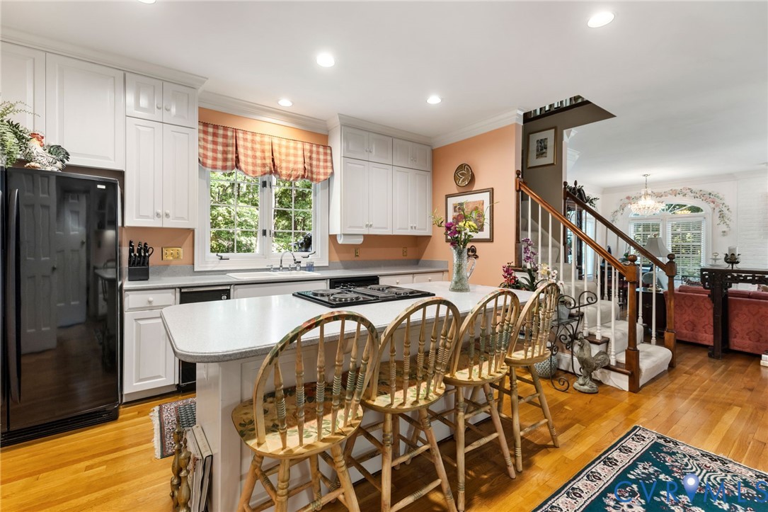 3950 Reeds Landing Circle Midlothian, VA 23113 - Photo 15 of 49 Kitchen with white cabinetry, a built-in cooktop,