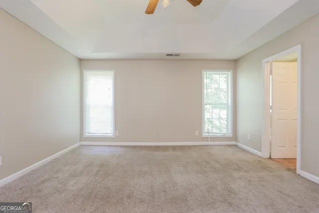 an empty room with windows