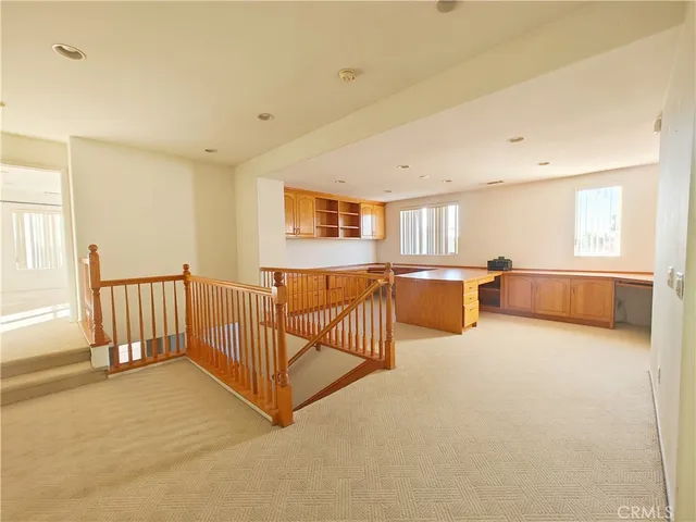 a view of a livingroom with furniture and a window