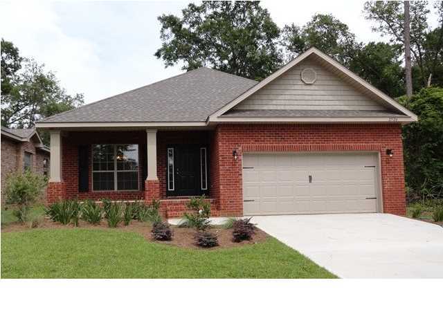 457 Pin Oak Loop Santa Rosa Beach, FL 32459 - Photo 14 of 14 a front view of a house with a yard and garage
