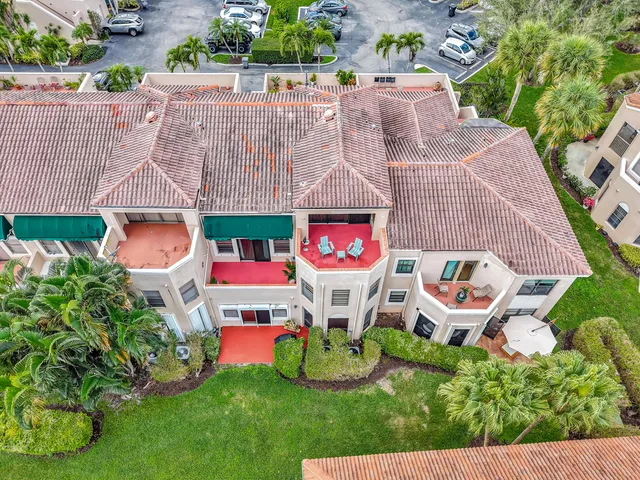 a view of a patio with table and chairs and potted plants