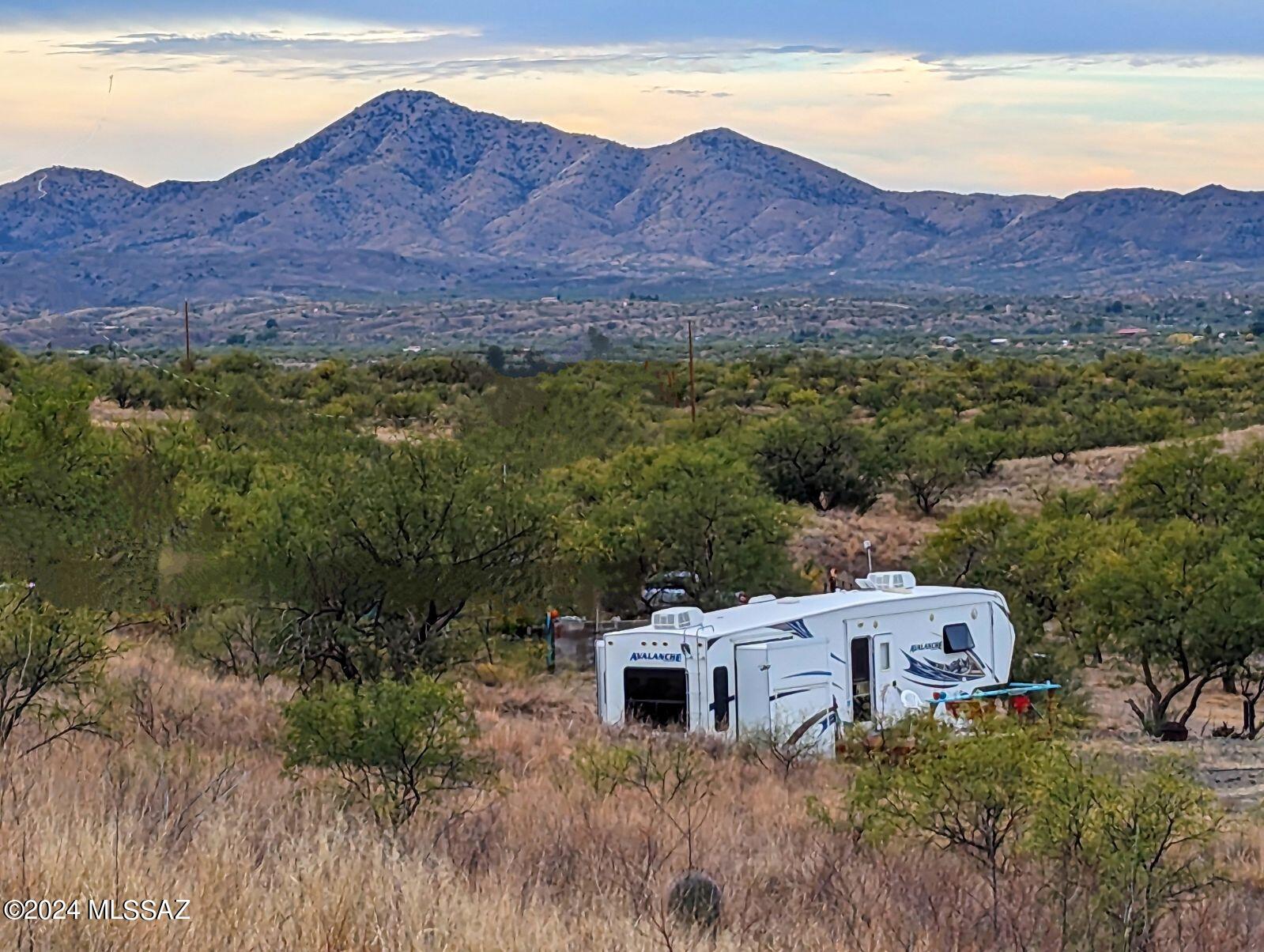 35700 South Cedar Creek Road Arivaca, AZ 85601 - Photo 40 of 44 a view of a lush green hillside and houses