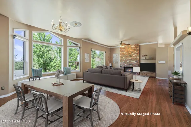 a view of kitchen with granite countertop cabinets and refrigerator