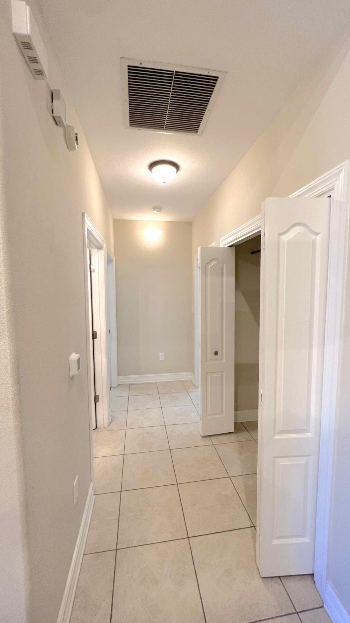 4230 Jade Loop Destin, FL 32541 - Photo 11 of 37 a view of a livingroom with a hallway