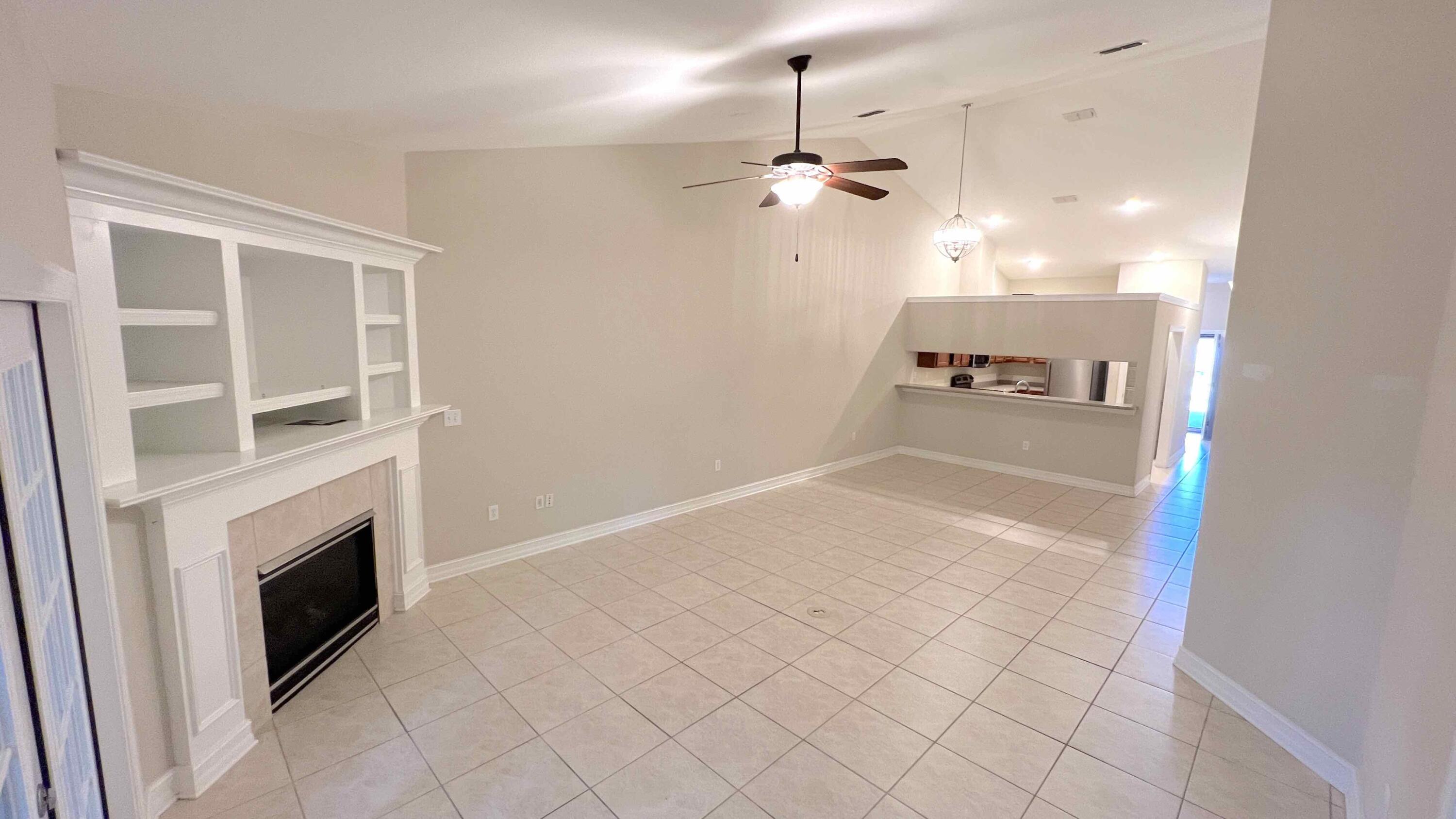 4230 Jade Loop Destin, FL 32541 - Photo 22 of 37 a view of a livingroom with a fireplace