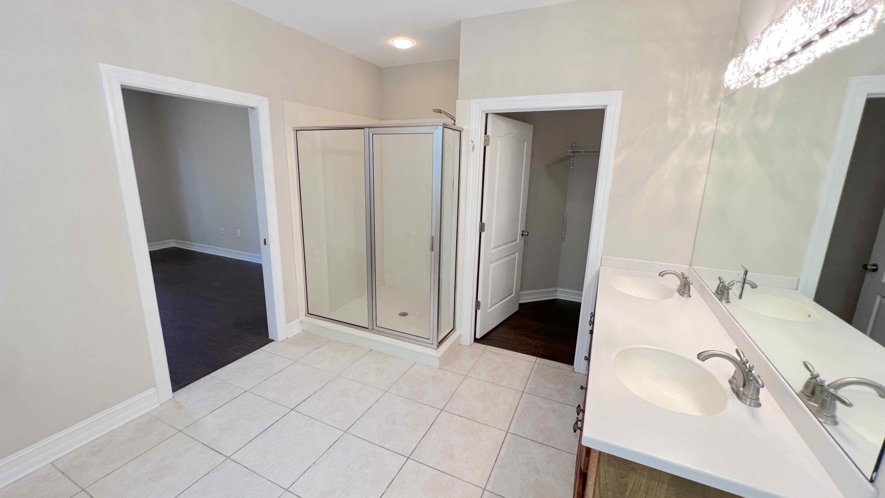 4230 Jade Loop Destin, FL 32541 - Photo 29 of 37 a bathroom with a sink and a mirror