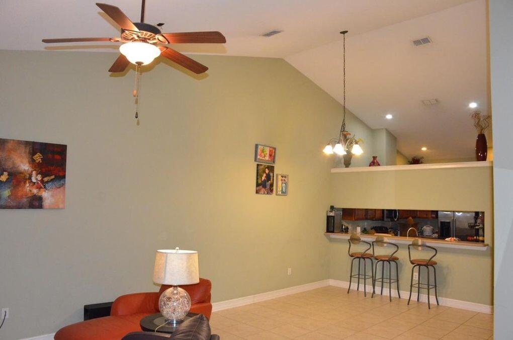 4230 Jade Loop Destin, FL 32541 - Photo 3 of 37 a view of a room with a table and chairs