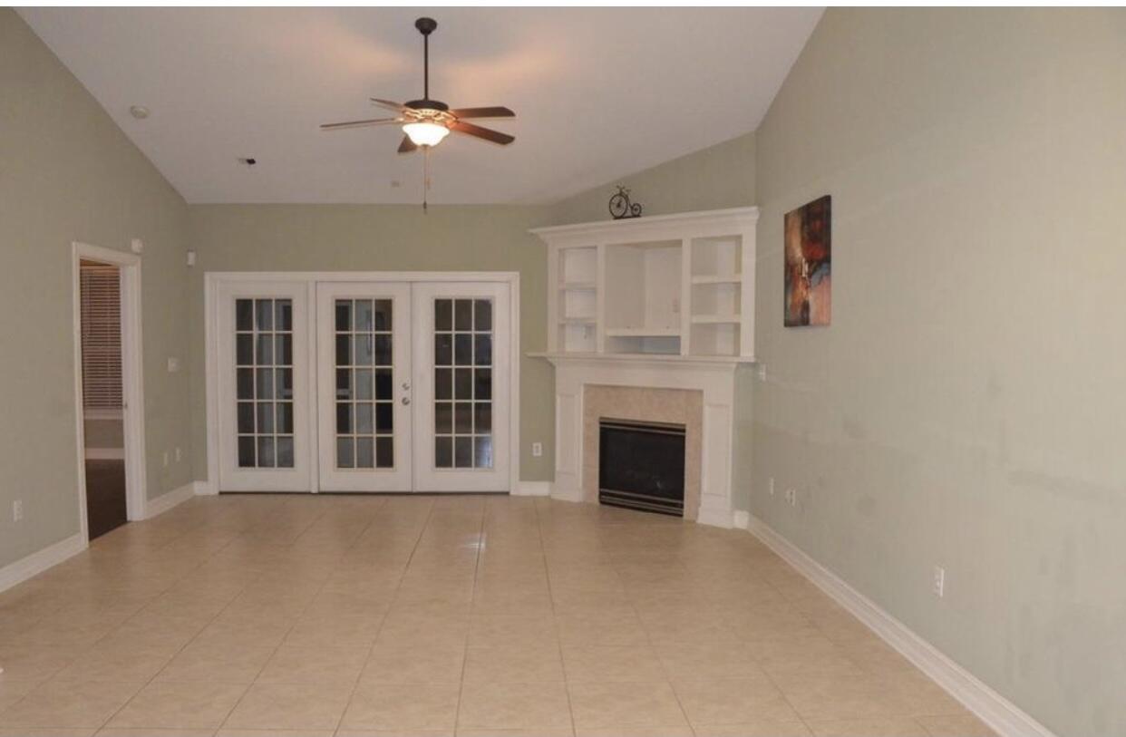 4230 Jade Loop Destin, FL 32541 - Photo 36 of 37 a view of an empty room with a fireplace