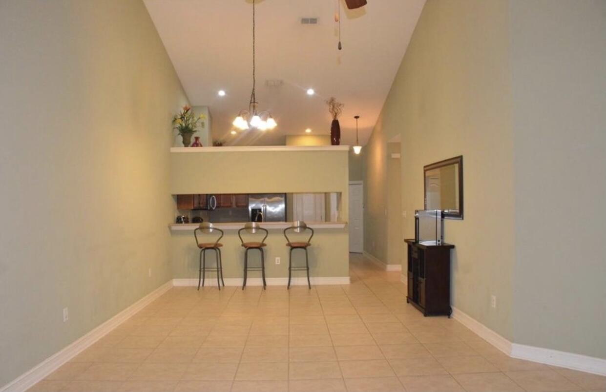 4230 Jade Loop Destin, FL 32541 - Photo 37 of 37 a view of a dining room with furniture and a chandelier