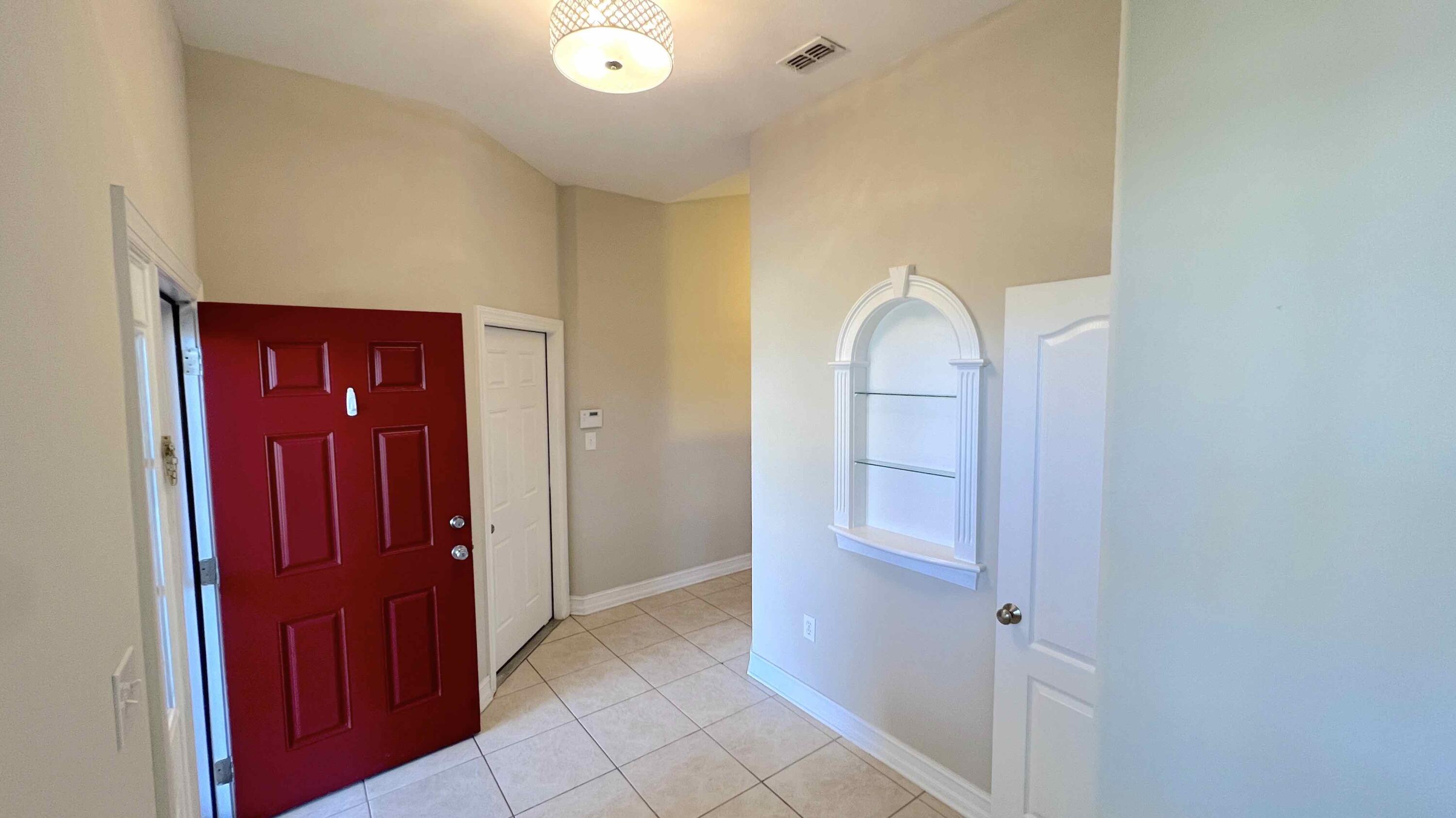 4230 Jade Loop Destin, FL 32541 - Photo 6 of 37 a view of a hallway to rooms