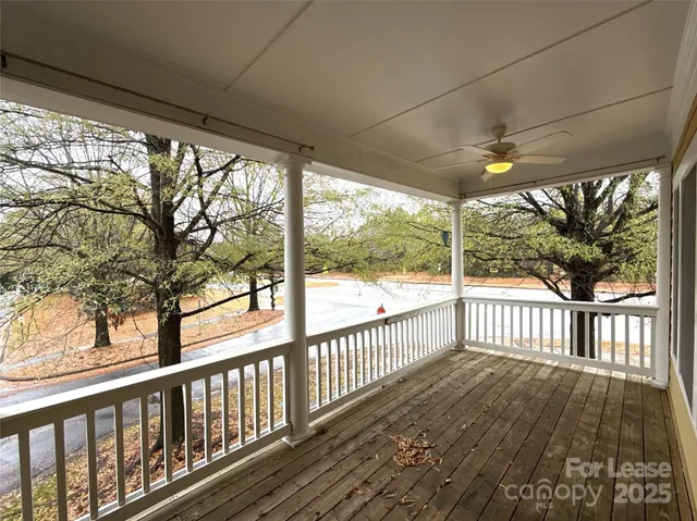 a view of a porch with wooden floor