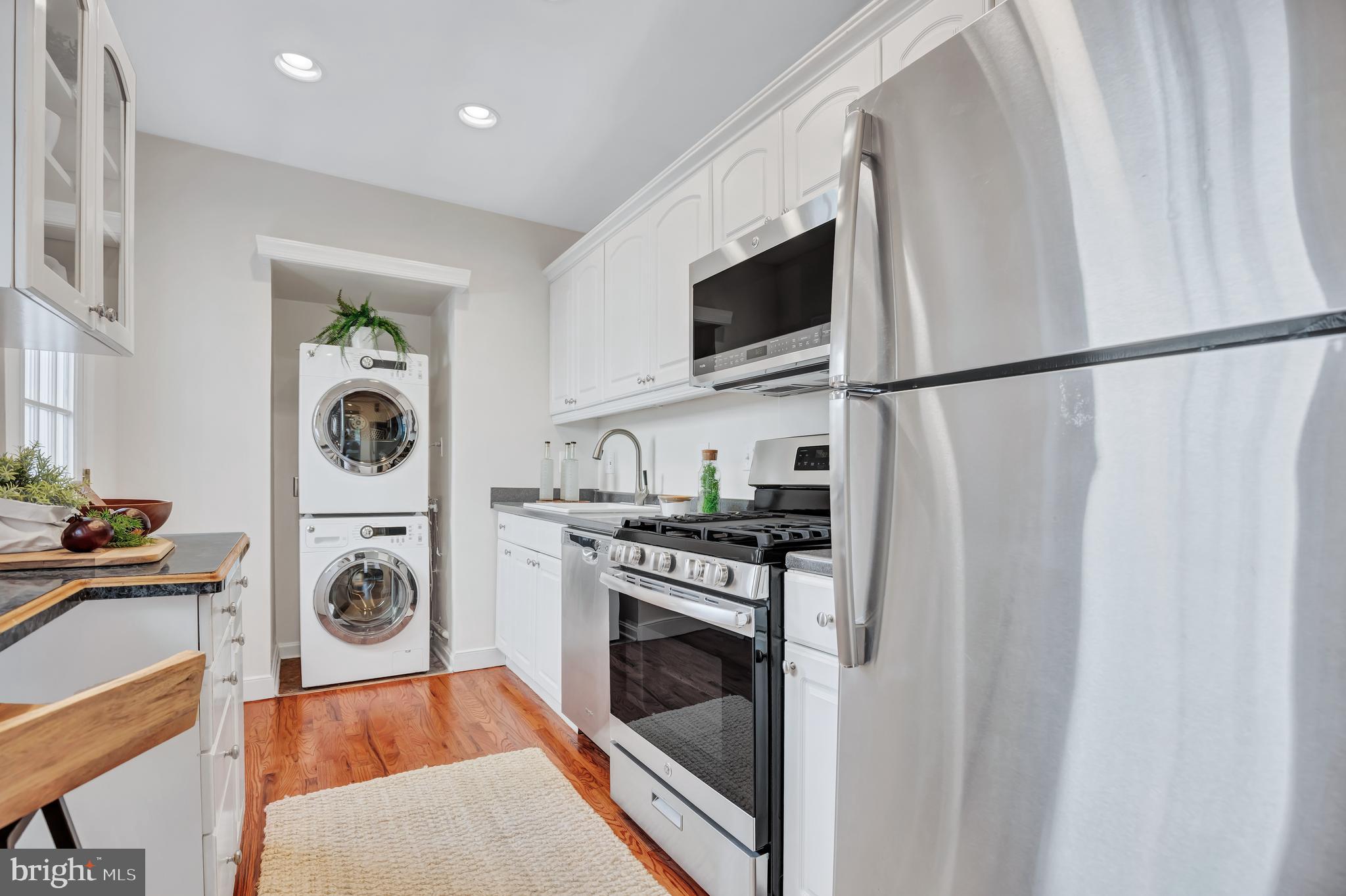 1437 Duke Street Alexandria, VA 22314 - Photo 14 of 45 a utility room with sink dryer and washer