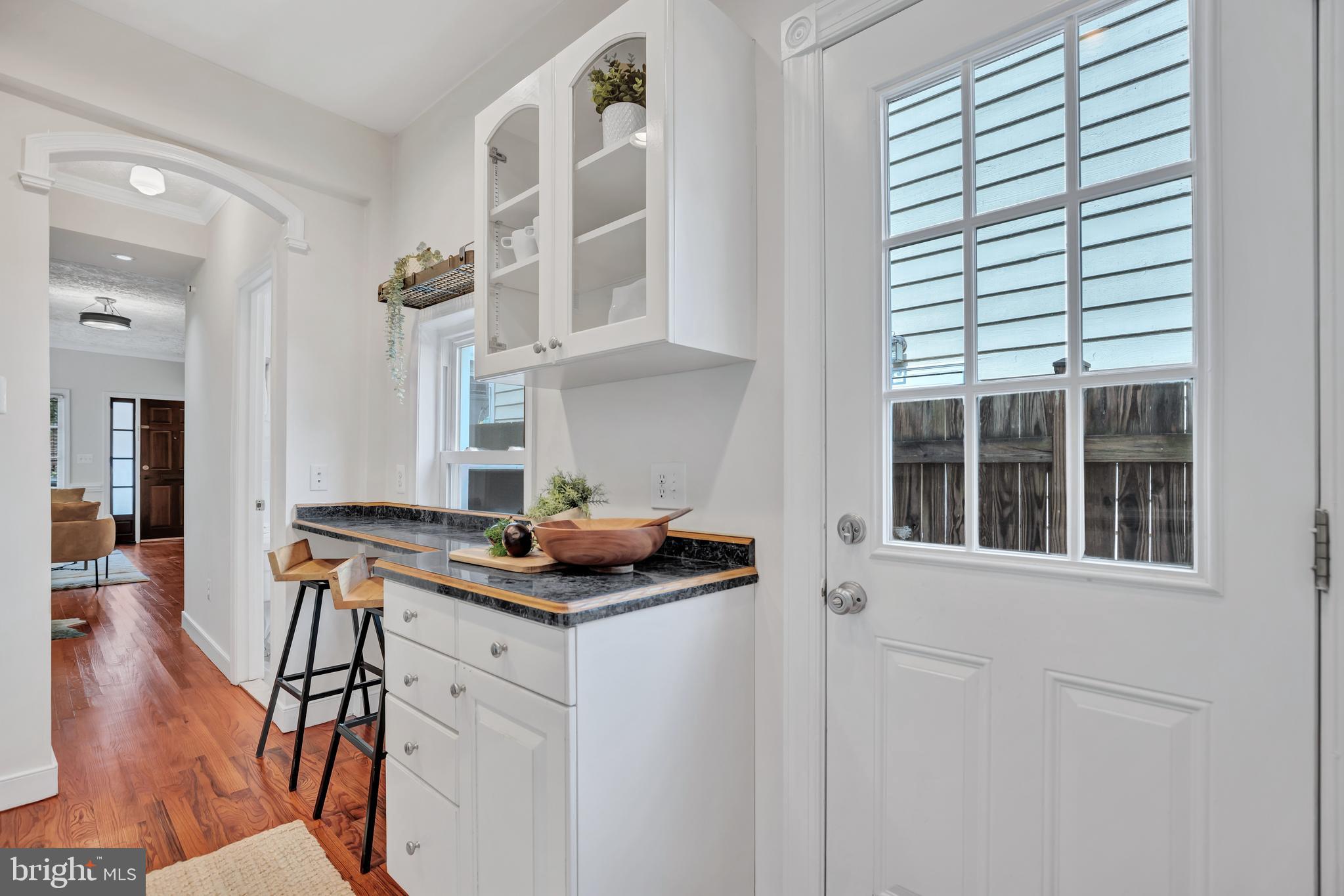 1437 Duke Street Alexandria, VA 22314 - Photo 15 of 45 a kitchen with stainless steel appliances granite countertop a stove and a sink