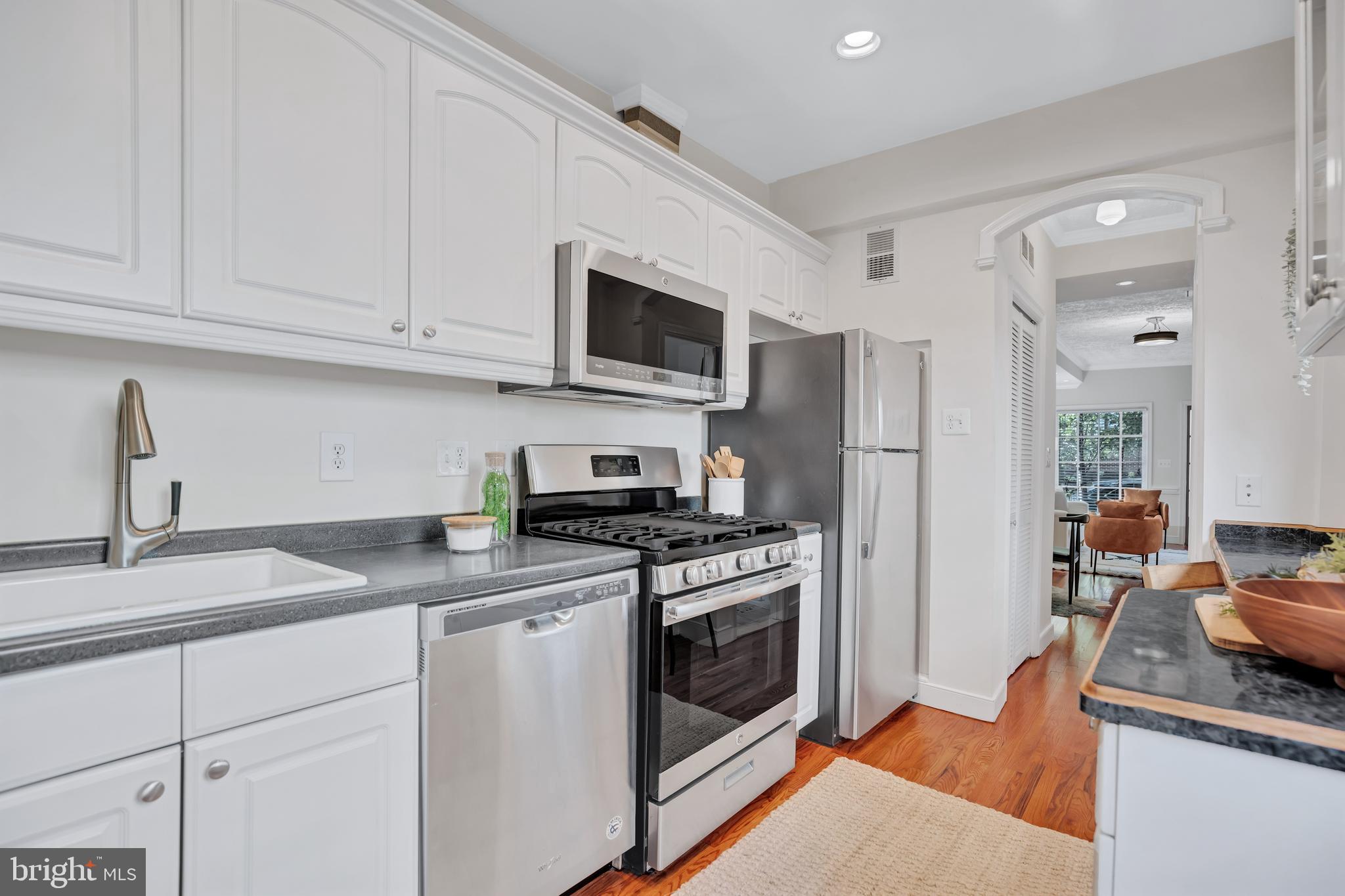 1437 Duke Street Alexandria, VA 22314 - Photo 16 of 45 a kitchen with stainless steel appliances granite countertop a stove a refrigerator and a sink