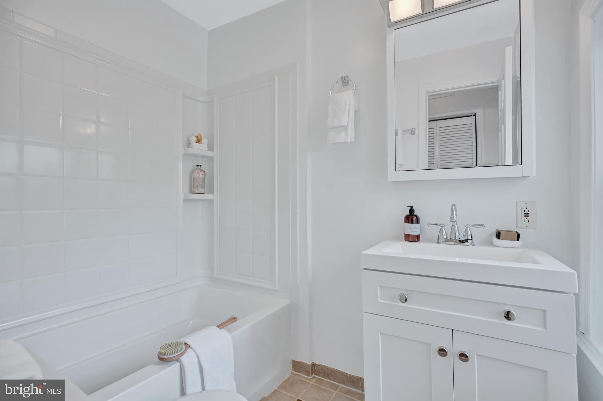 1437 Duke Street Alexandria, VA 22314 - Photo 18 of 45 a bathroom with a sink a toilet and vanity