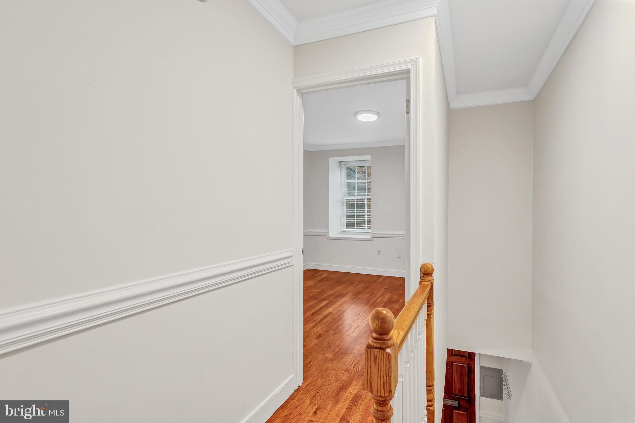 1437 Duke Street Alexandria, VA 22314 - Photo 24 of 45 a view of a bedroom with wooden floor and a window