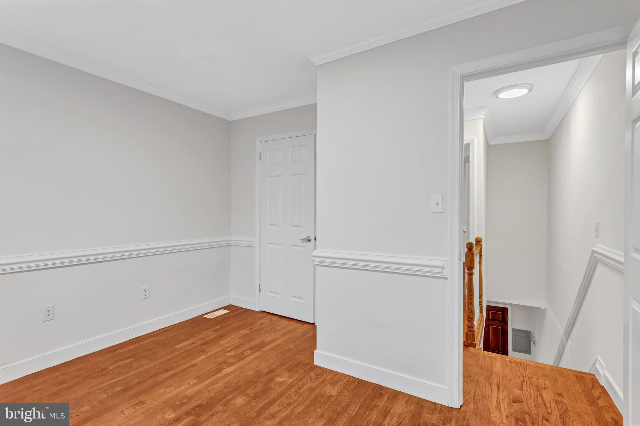 1437 Duke Street Alexandria, VA 22314 - Photo 26 of 45 a view of empty room with wooden floor