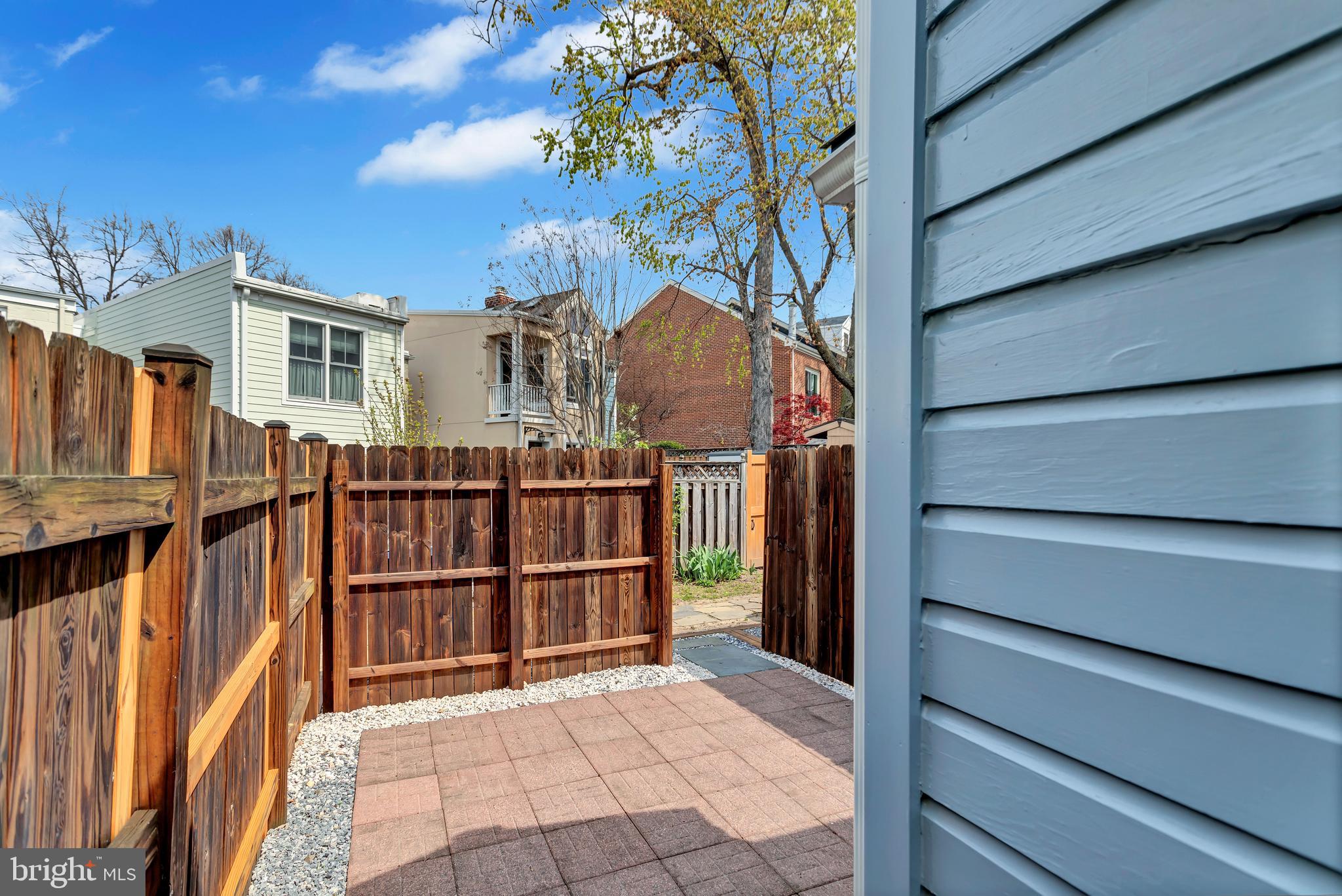 1437 Duke Street Alexandria, VA 22314 - Photo 27 of 45 a view of a house with a small yard
