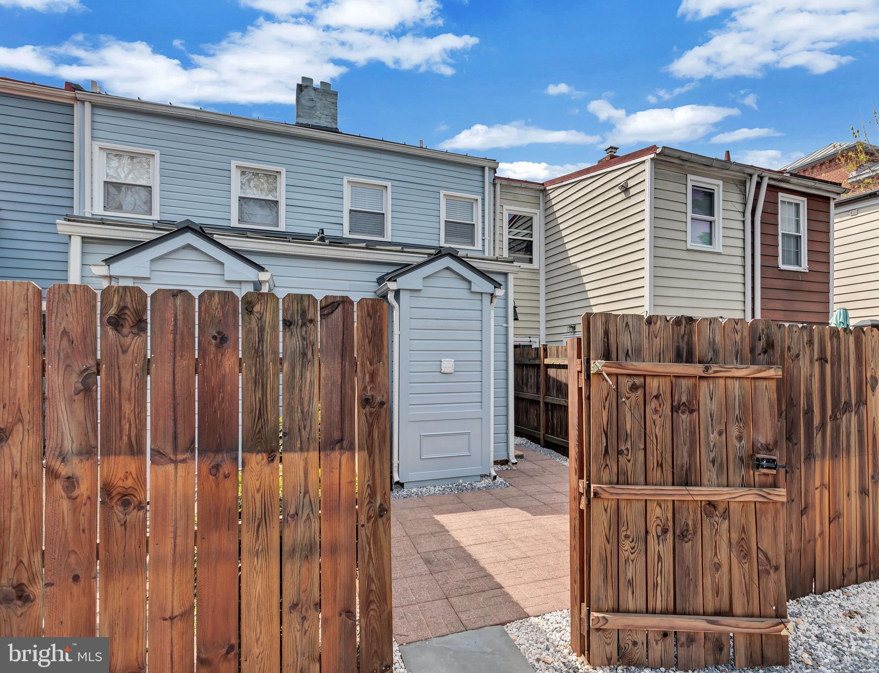 1437 Duke Street Alexandria, VA 22314 - Photo 30 of 45 a view of a house with wooden fence