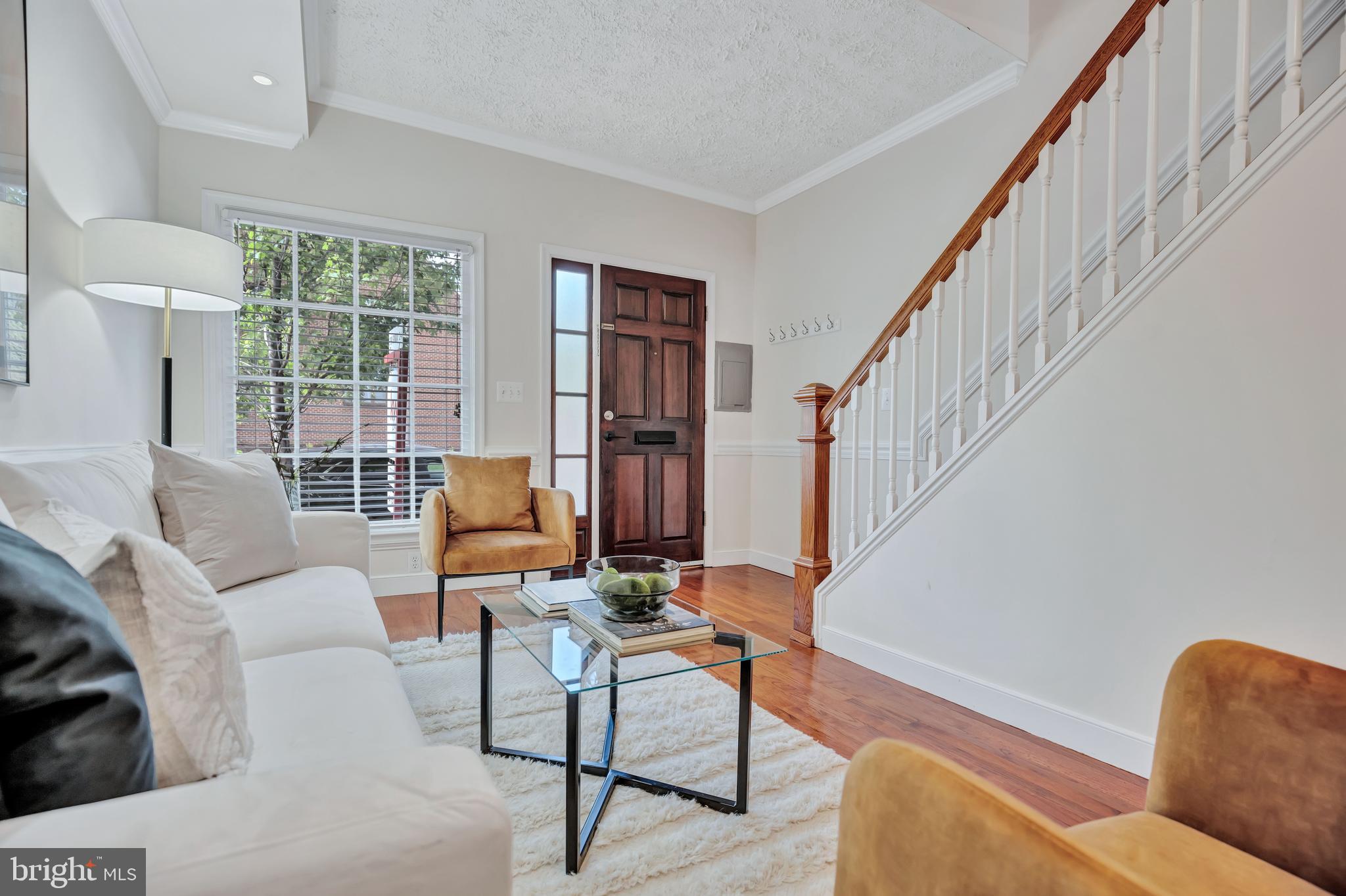 1437 Duke Street Alexandria, VA 22314 - Photo 3 of 45 a living room with furniture and a window