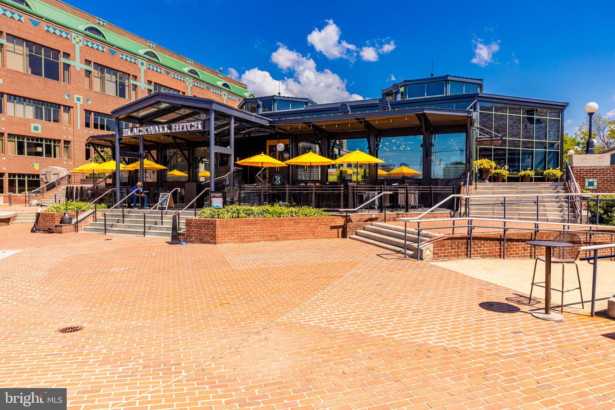 1437 Duke Street Alexandria, VA 22314 - Photo 38 of 45 a view of a patio with a table and chairs under an umbrella