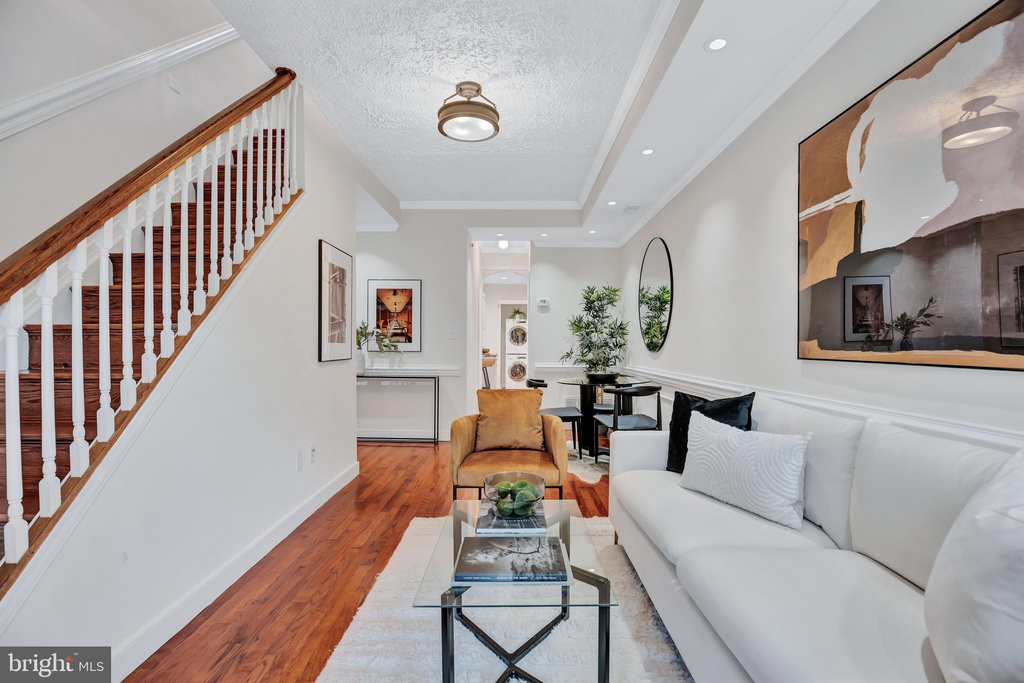 1437 Duke Street Alexandria, VA 22314 - Photo 4 of 45 a living room with furniture and a wooden floor