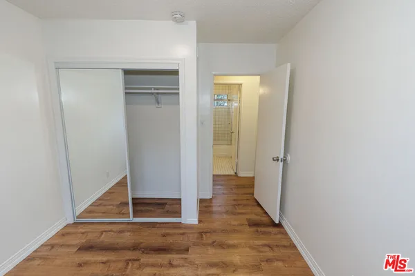 a house with flower garden in front of it