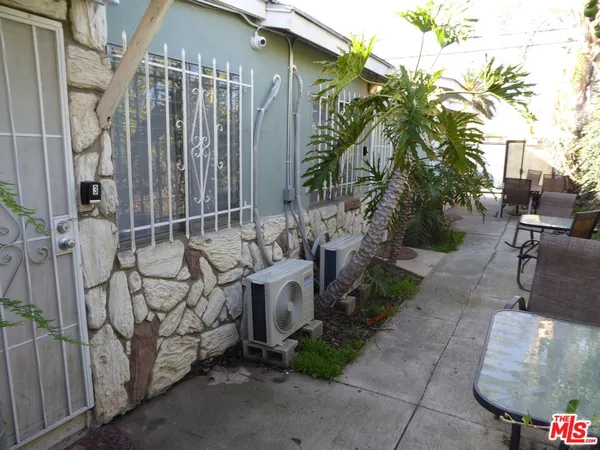 a view of a house with a tree