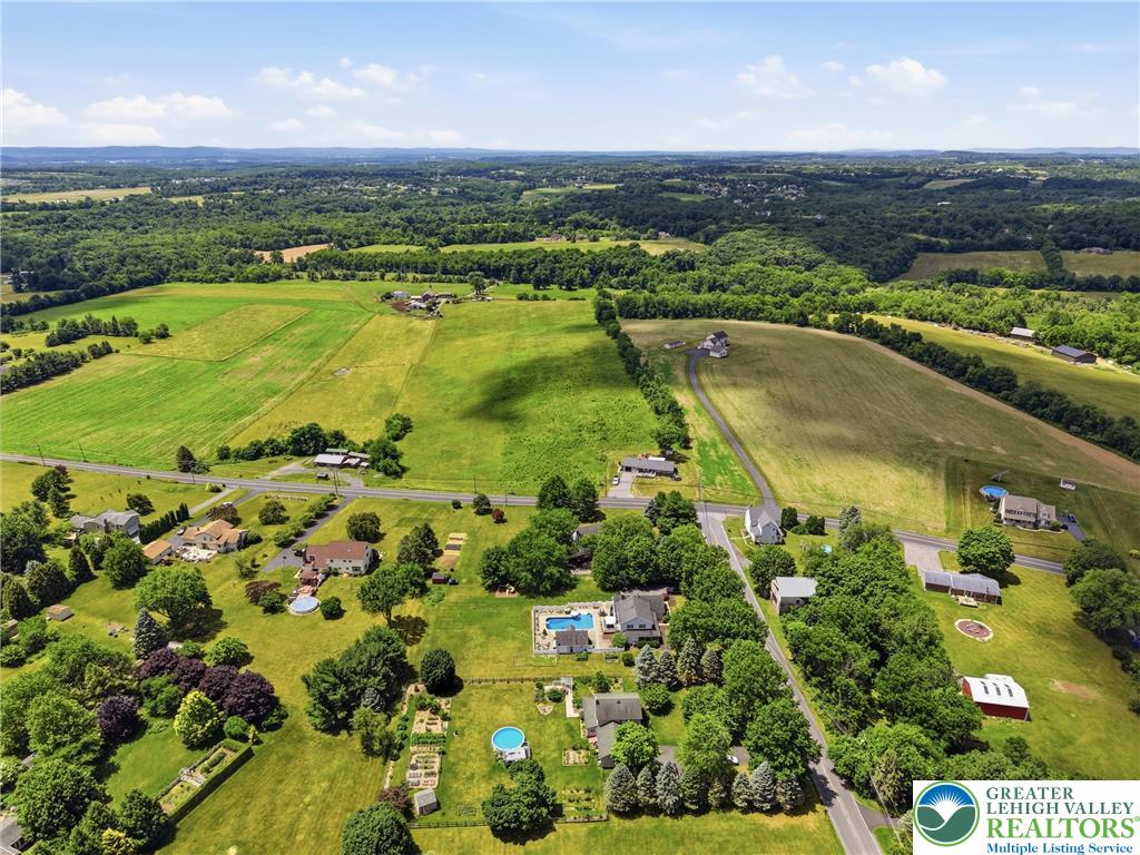890 Lahr Road Nazareth, PA 18064 - Photo 61 of 71 An aerial perspective showcases a rural community with ample green spaces and private pools.