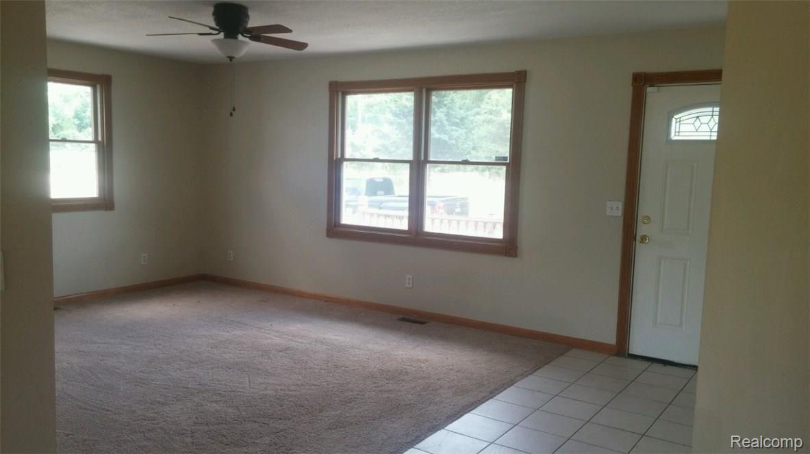 11321 McCaughna Road Byron, MI 48418 - Photo 10 of 12 11321 Living Room.jpg