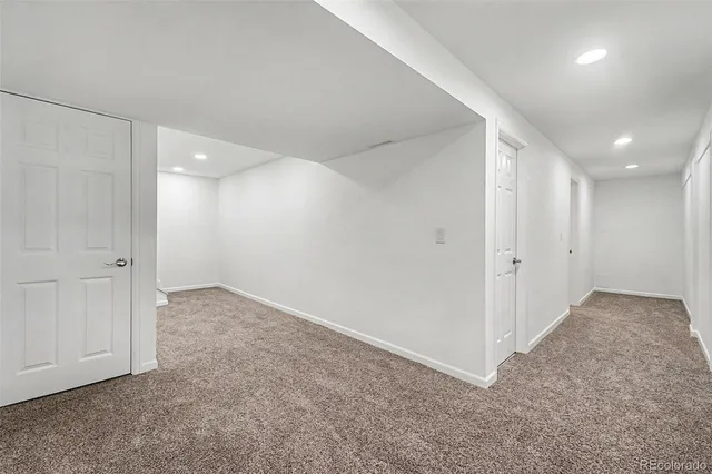 a view of an empty room and closet area
