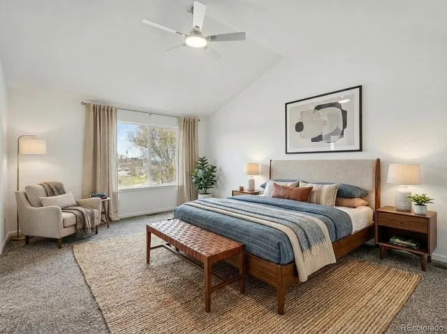 a bedroom with a bed and a couch