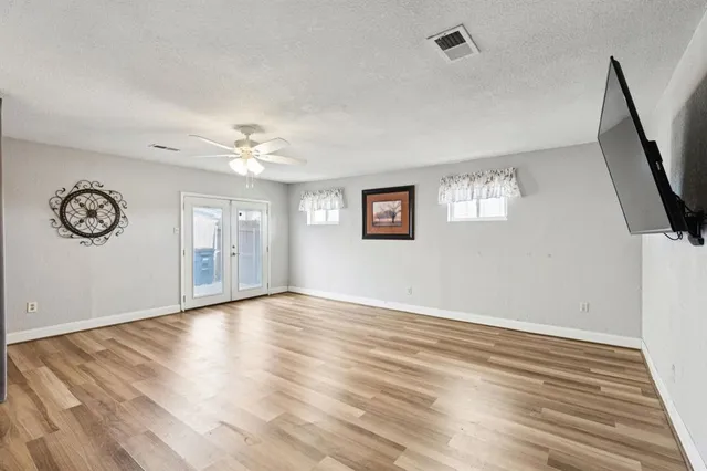 a view of livingroom with window and hardwood floor