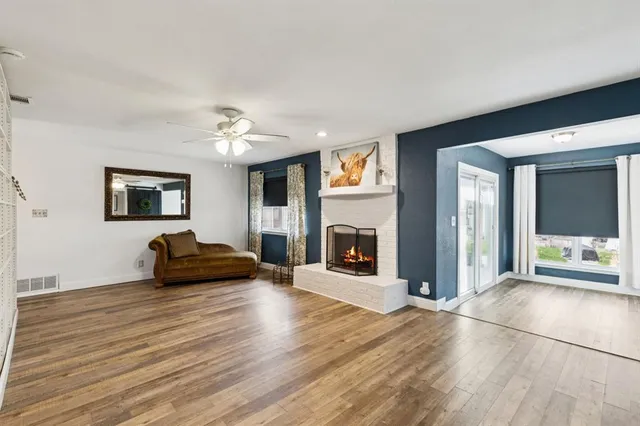 a living room with furniture and a fireplace