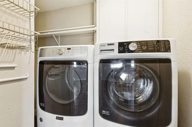 a utility room with dryer and washer