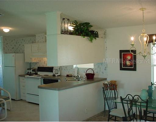 3499 Stockton Road Port Charlotte, FL 33953 - Photo 12 of 12 Kitchen - SPACIOUS FLOORPLAN! VOLUME CEILINGS, FORMAL DINING RM AND WONDERFUL KITCHEN WITH LOTS OF COUNTER SPACE!