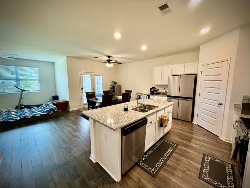2015 Waycross Lane Dacula, GA 30019 - Photo 16 of 49 a large white kitchen with sink stove and refrigerator