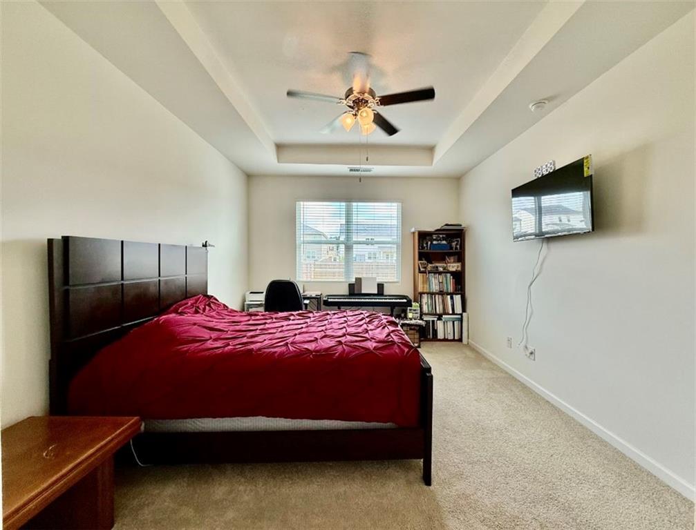 2015 Waycross Lane Dacula, GA 30019 - Photo 29 of 49 a bedroom with a bed and a tv