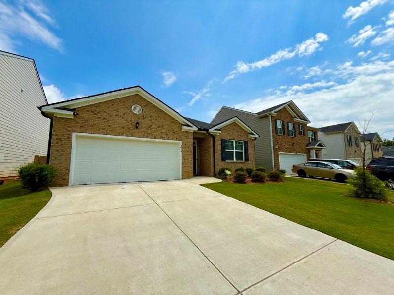 2015 Waycross Lane Dacula, GA 30019 - Photo 4 of 49 a front view of a house with a yard and garage